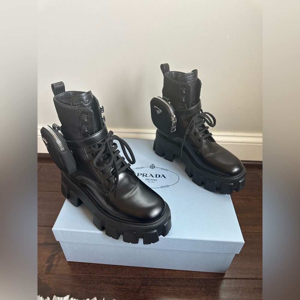 Prada 
Monolith brushed leather and nylon boots with 2 pouches.